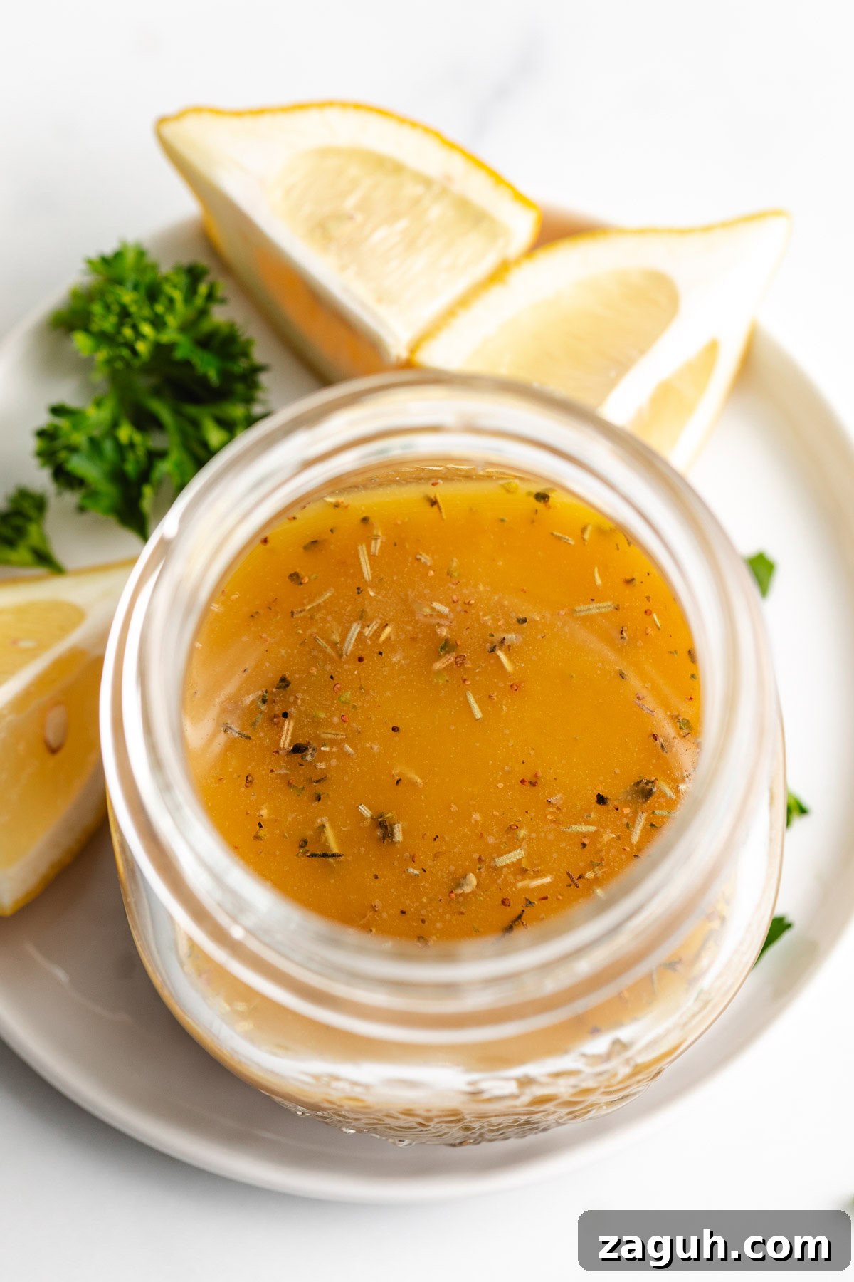 Authentic Italian Dressing Recipe for Fresh Flavor 6 Overhead view of Italian dressing next to lemons.