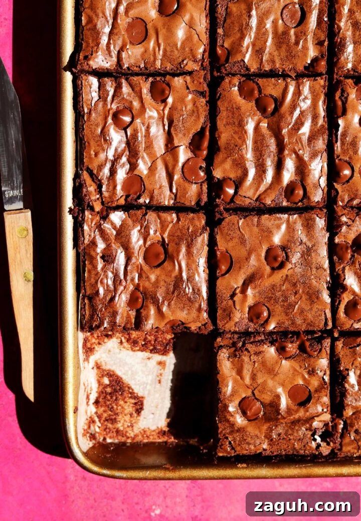 Chewy Sheet-Pan Brownies: One-Pan Recipe for Fudgy Bars 2 sheet pan brownies sliced in pan