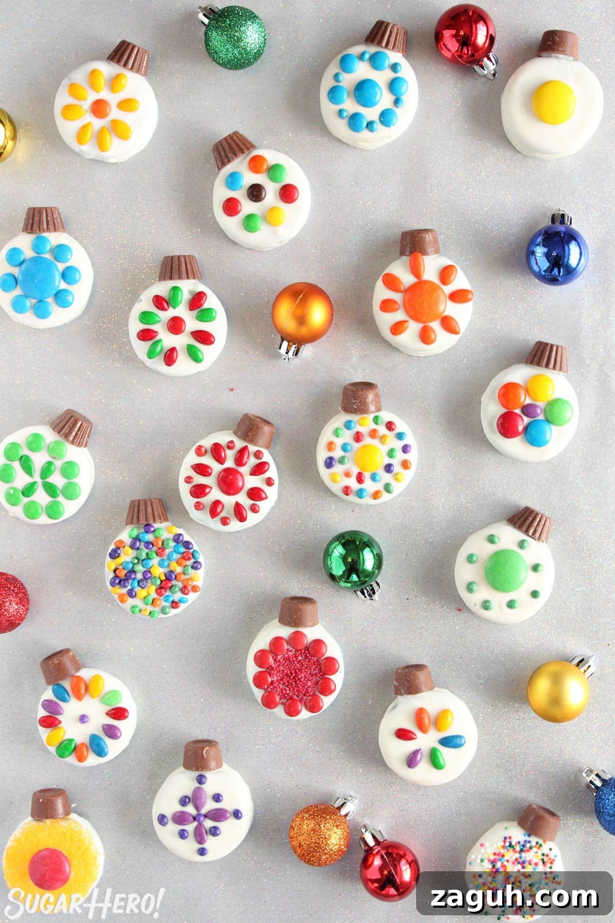 DIY Oreo Cookie Christmas Ornaments: Festive Homemade Ideas 2 Overhead shot of colorful Oreo Cookie Christmas Ornaments on a silver background with colorful ornaments around.