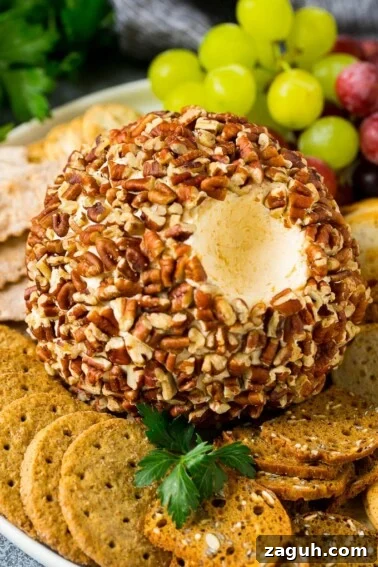 Crispy Southern Fried Pickles Recipe for Ultimate Crunch 2 A cheese ball with a serving scooped out.