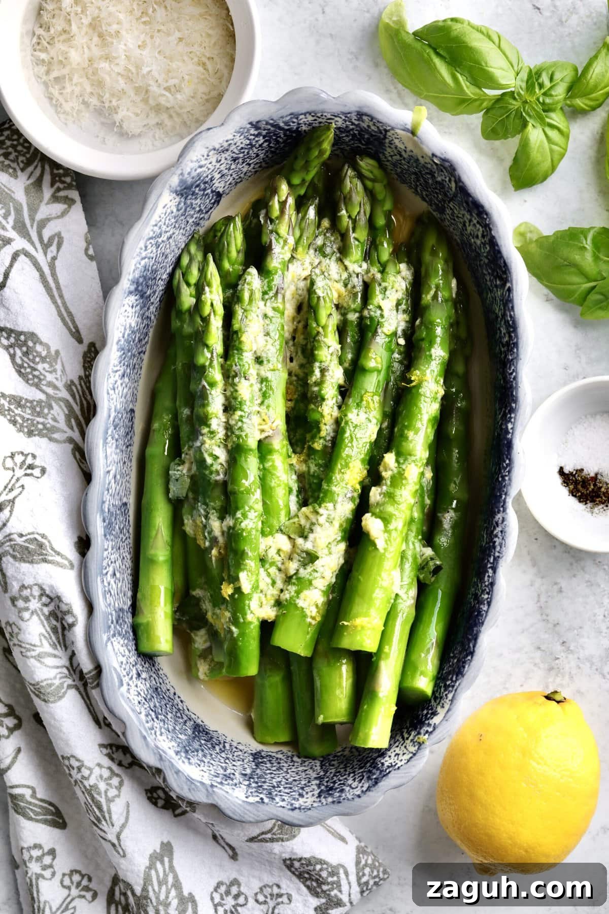 Quick Steamed Asparagus Recipe for Tender, Crisp Spears 2 Finished steamed asparagus in a serving dish.