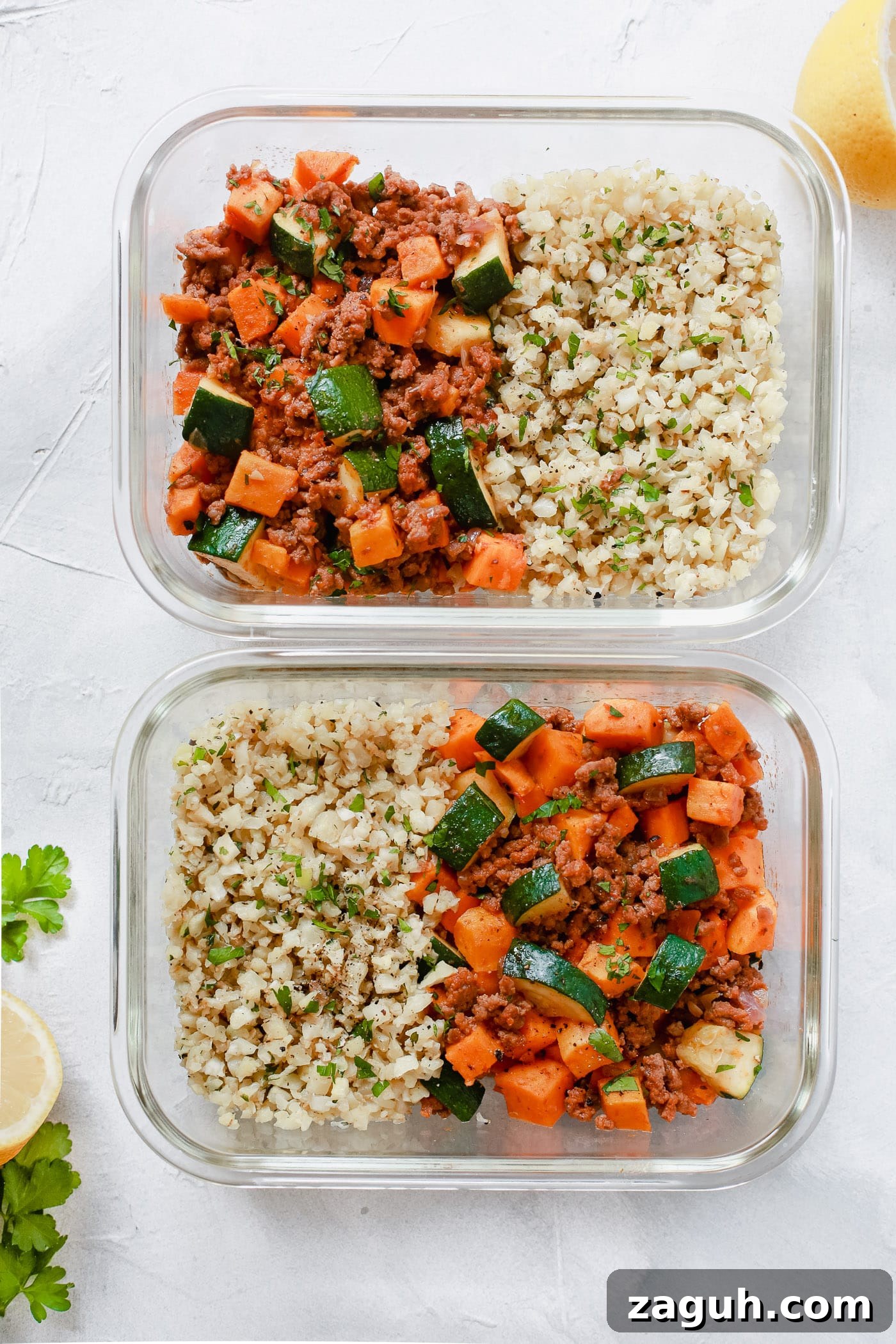 15 Whole30 Meal-Prep Recipes for Stress-Free Weekly Planning 3 Two glass meal prep containers with ground beef, zucchini, sweet potatoes, and cauliflower rice.