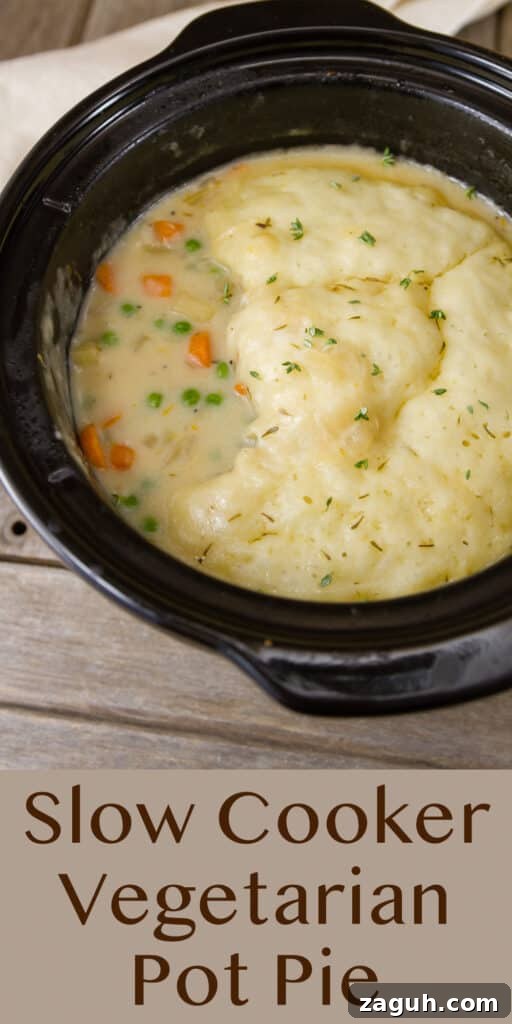 Slow Cooker Creamy Vegetable Pot Pie Recipe 9 looking down into the black insert of a crock pot that's filled with soup, title underneath Slow Cooker Vegetarian Pot Pie.