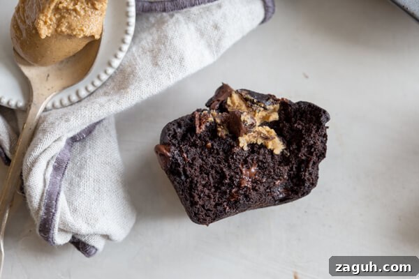 Banana Chocolate Chip Muffins with Oats and Greek Yogurt 5 half eaten Reeses peanut butter cup banana chocolate chip muffin