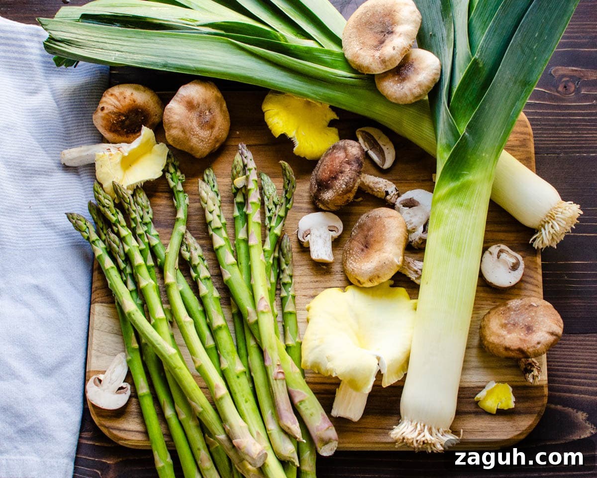 Asparagus, Mushroom & Gruyère Quiche with Leeks for Spring Brunch 3 Ingredients on a cutting board.
