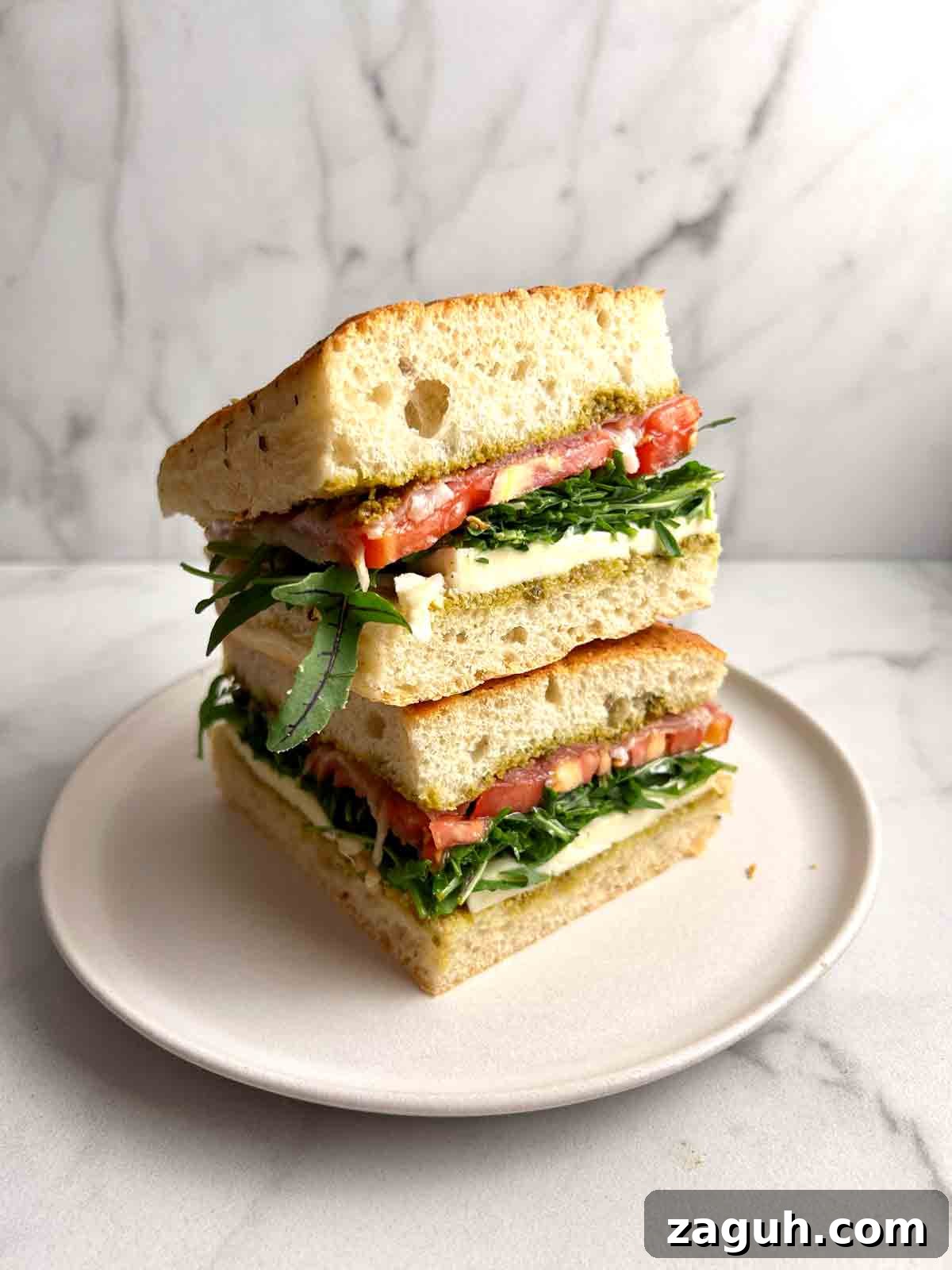 Focaccia Sandwich Recipes: Flavorful Ideas for Lunch & Picnics 2 two slices of focaccia sandwich stacked on top of each other.