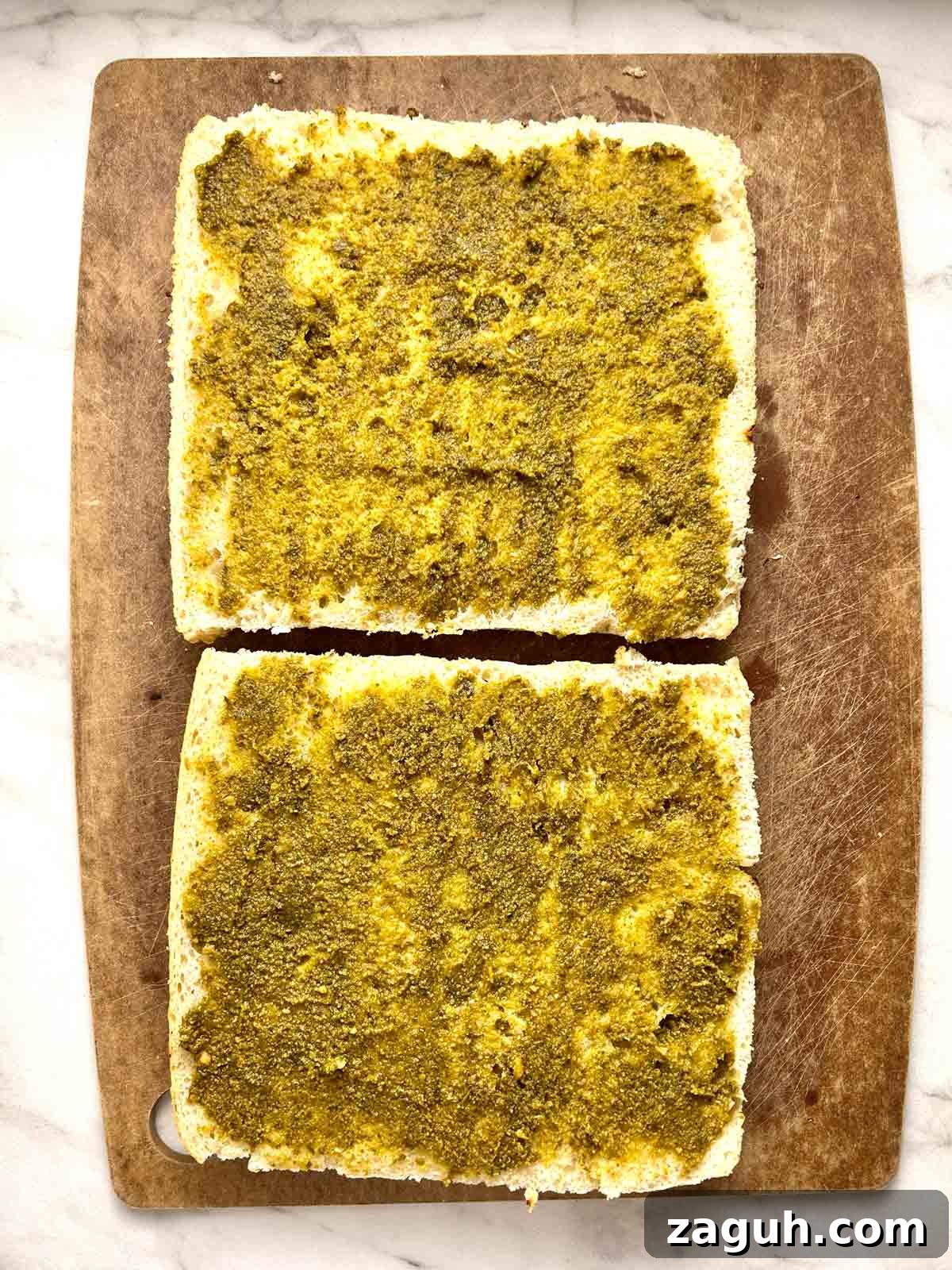 Focaccia Sandwich Recipes: Flavorful Ideas for Lunch & Picnics 4 pesto spread on focaccia halves.
