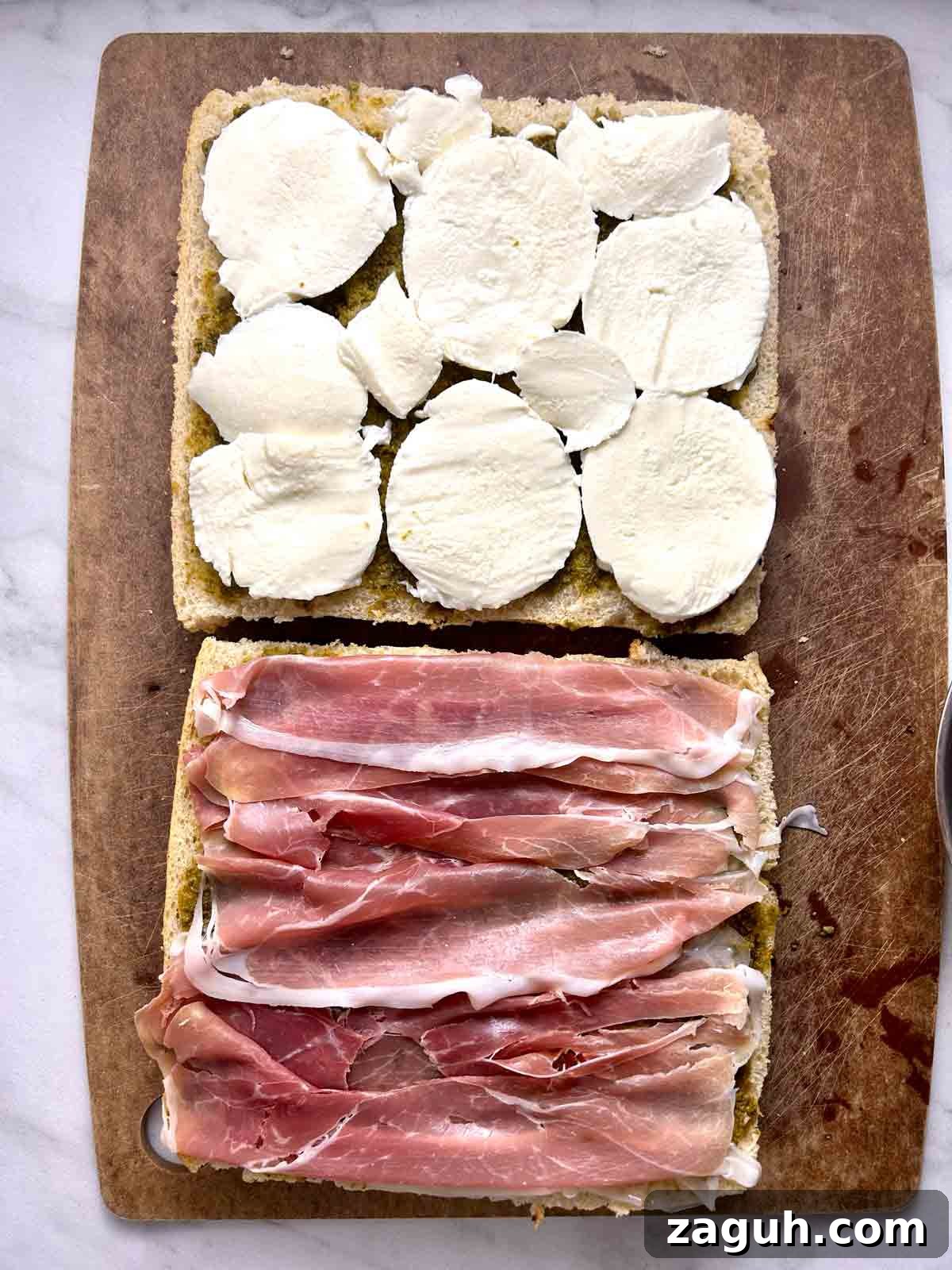 Focaccia Sandwich Recipes: Flavorful Ideas for Lunch & Picnics 5 mozzarella and meat on focaccia halves.