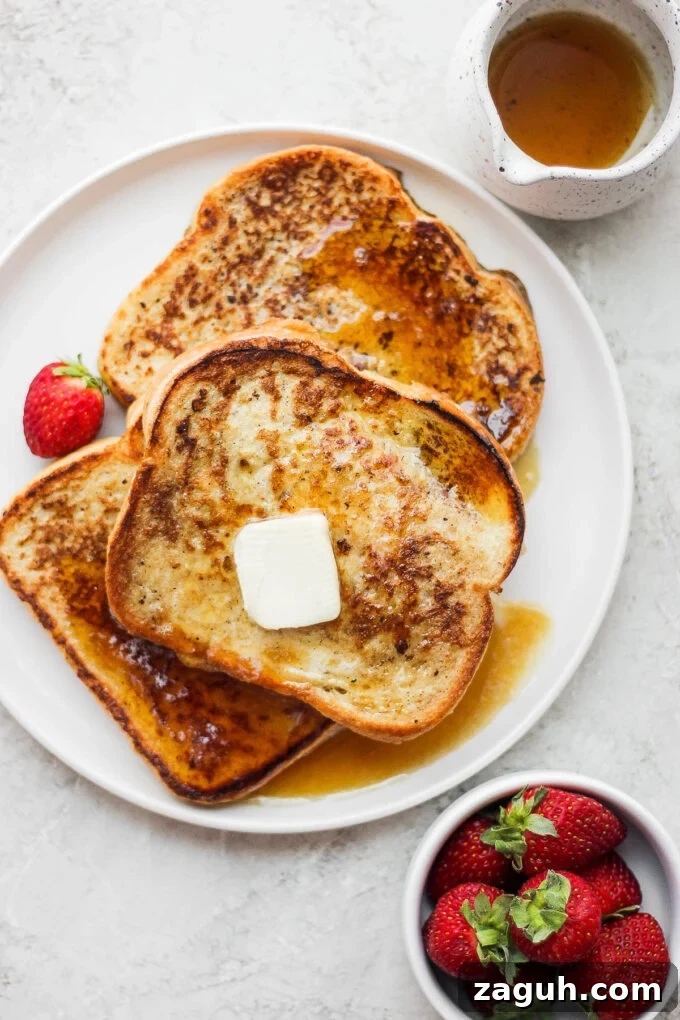 15-Minute Cinnamon French Toast Recipe for Busy Mornings 2 Cinnamon French Toast topped with butter and maple syrup.