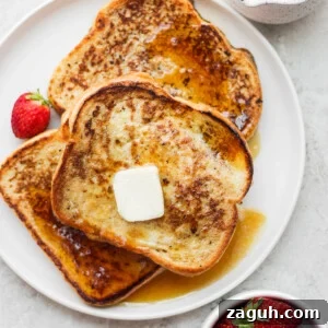 15-Minute Cinnamon French Toast Recipe for Busy Mornings 10 Cinnamon French Toast topped with butter and maple syrup.
