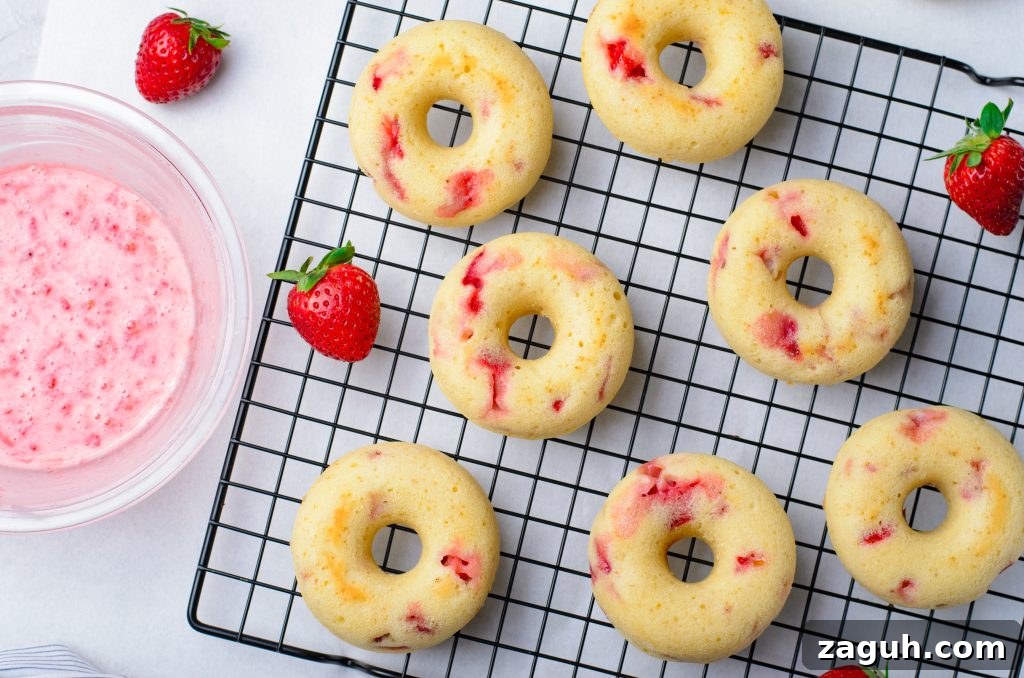 Strawberry-Glazed Baked Donuts: Light, Fruity Recipe 6 baked strawberry donuts shown on a metal cooling wrack
