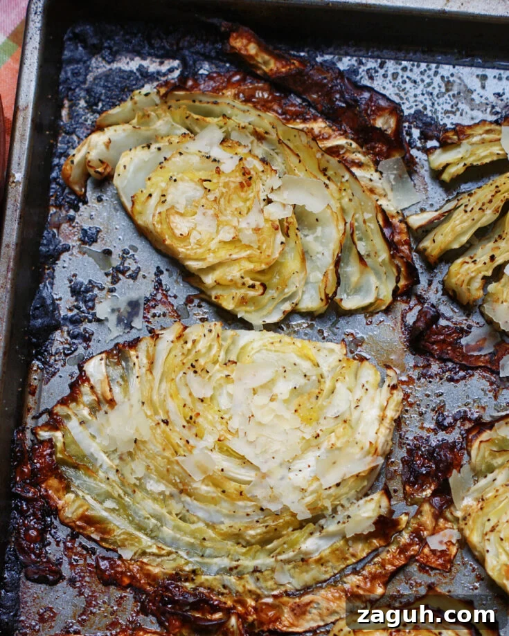 close up of beefy roasted cabbage steaks to show caramelization and seasonings
