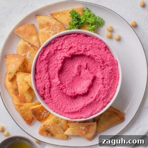 Creamy Beet Hummus Recipe with Garlic and Lemon 13 beetroot hummus served with pita chips.