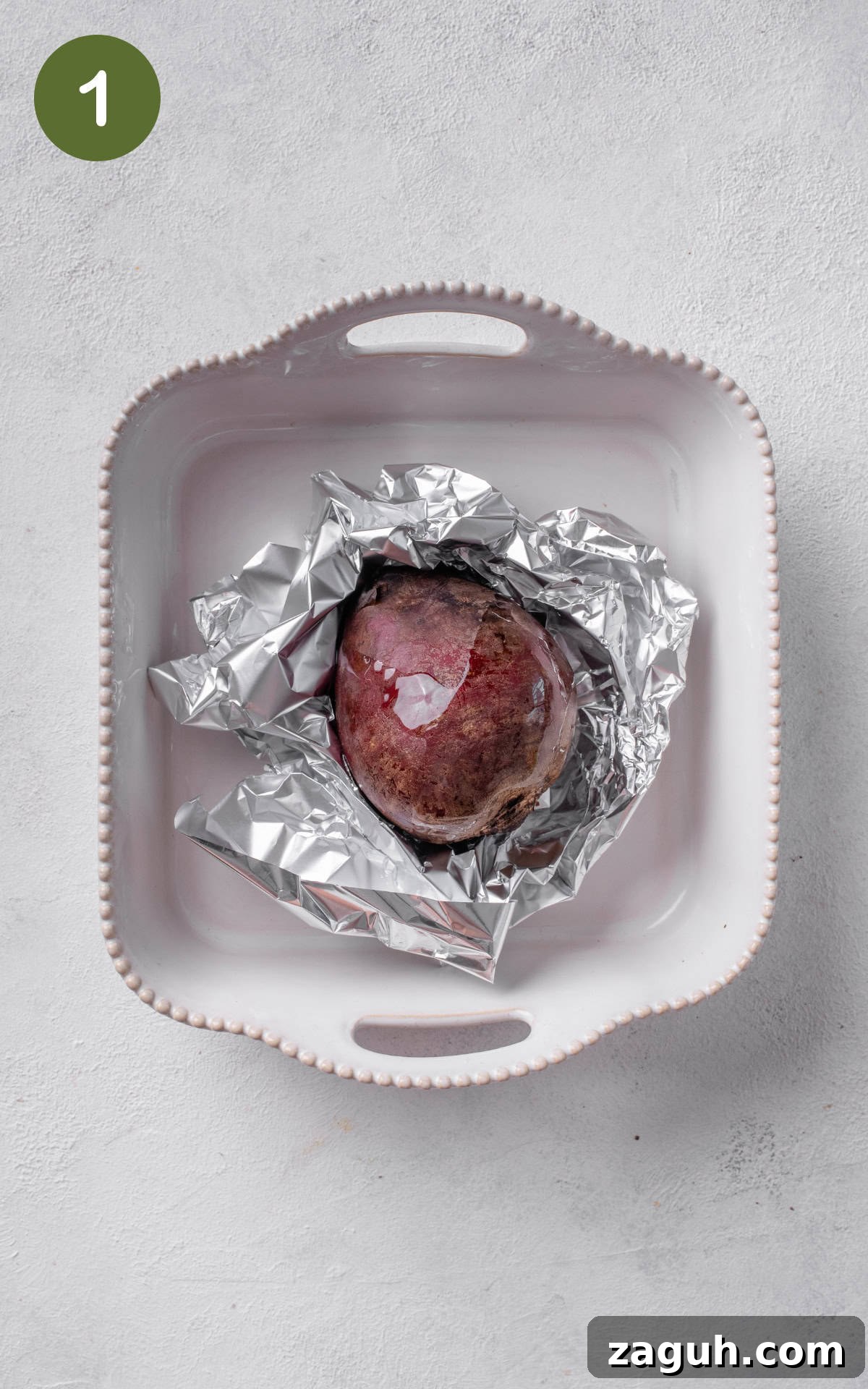 Creamy Beet Hummus Recipe with Garlic and Lemon 4 beet on a piece of aluminum foil.