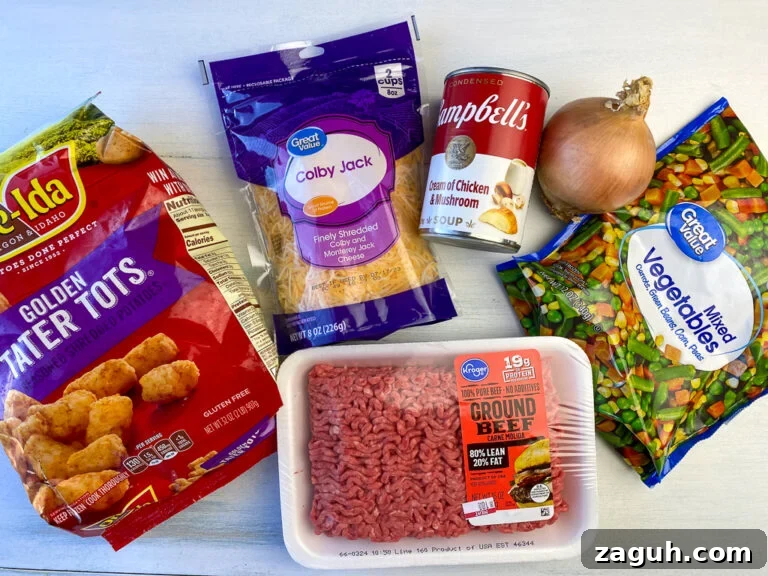 Cheesy Hamburger and Tater Tot Casserole Recipe That Families Love 5 Ingredients to make hamburger tater tot casserole are golden tater tots, colby jack cheese, cream of chicken and mushroom soup, an onion, mixed vegetables with carrots, green beans, corn and peas and a pound of lean ground beef