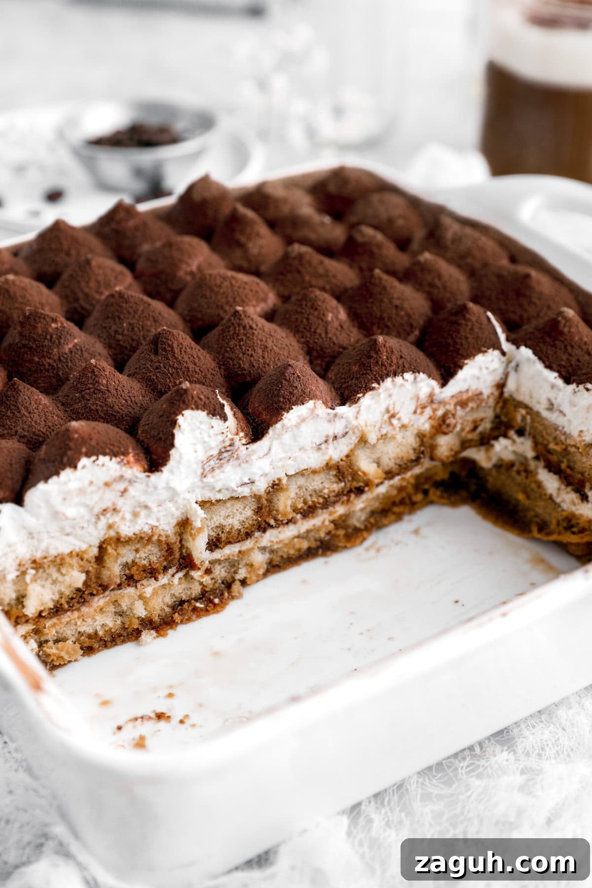 Authentic Italian Tiramisu Recipe: Step-by-Step Classic Guide 13 cropped close up of slice tiramisu in casserole.