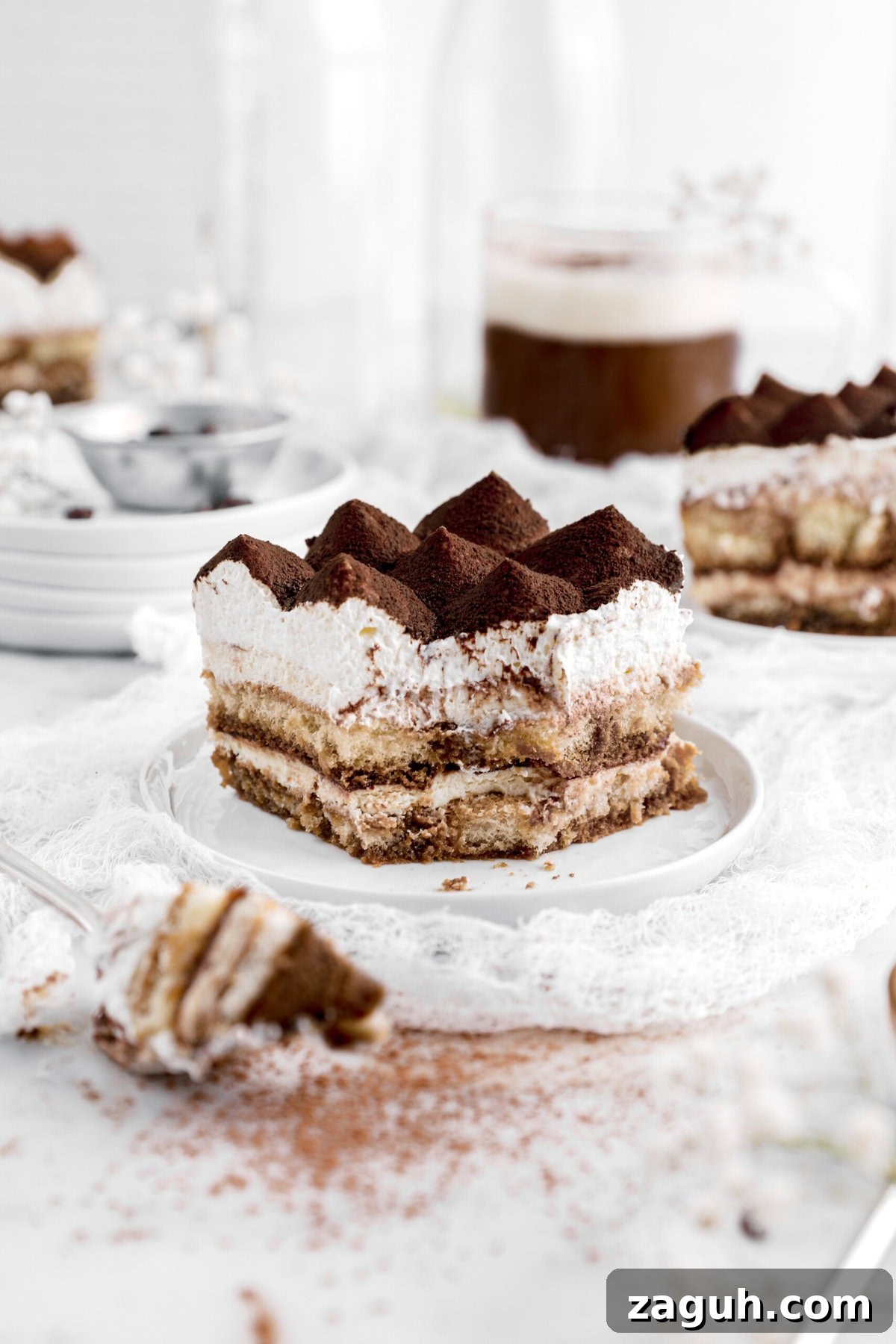 Authentic Italian Tiramisu Recipe: Step-by-Step Classic Guide 14 close up of bite missing from tiramisu with fork beside.