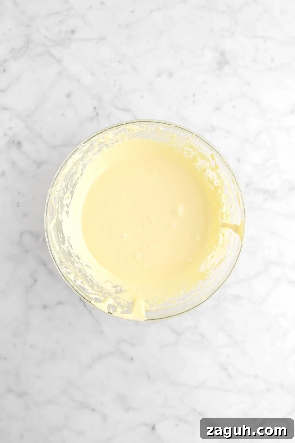 Authentic Italian Tiramisu Recipe: Step-by-Step Classic Guide 7 whipped egg yolk mixture in glass bowl