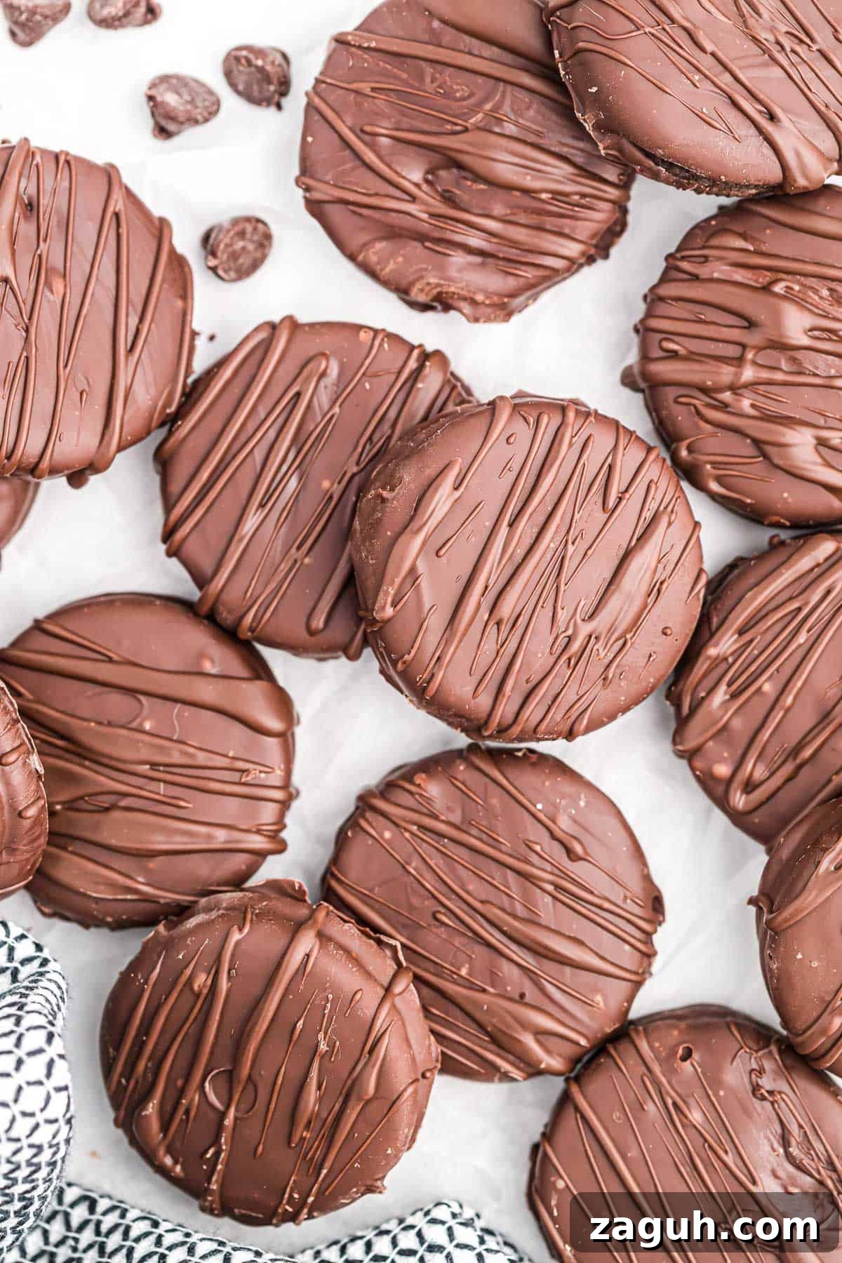 How to Make Chocolate-Covered Oreos at Home 3 chocolate covered oreos on wax paper