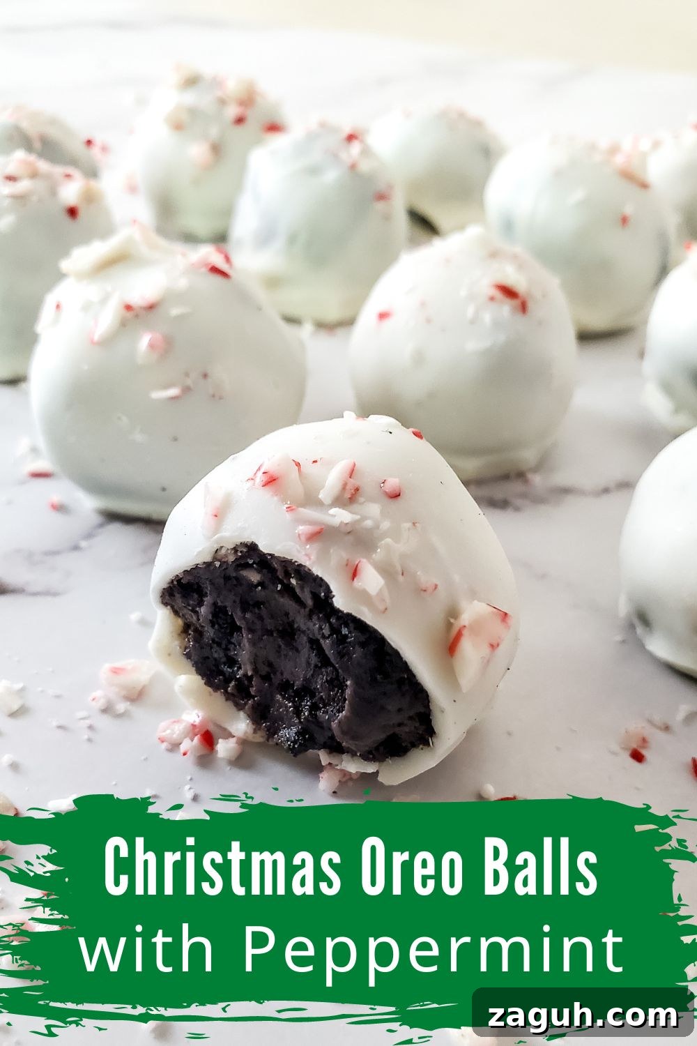 Peppermint Christmas Oreo Truffles — No-Bake Holiday Candy 2 christmas ore bites with one bite taken out