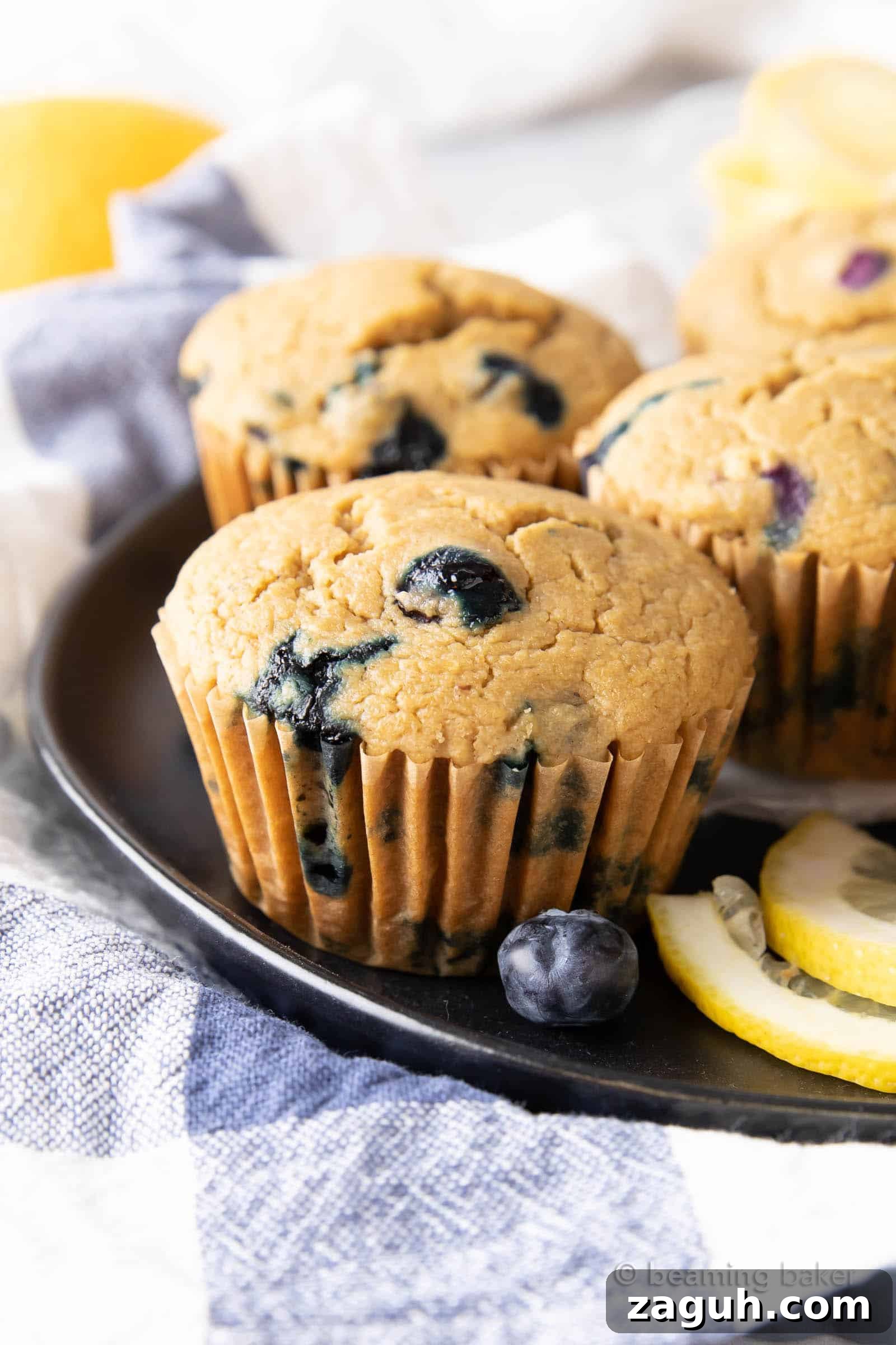 Lemon Blueberry Muffins Recipe with Zesty Citrus Glaze 2 Healthy Lemon Blueberry Muffins: moist and delicious healthy lemon blueberry muffins made with whole ingredients.