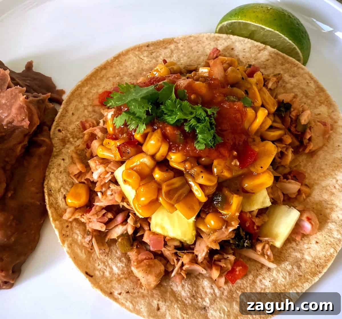 Jackfruit Carnitas: Flavorful Vegan Pulled Pork Tacos 4 Jackfruit carnitas recipe as a taco on a plate