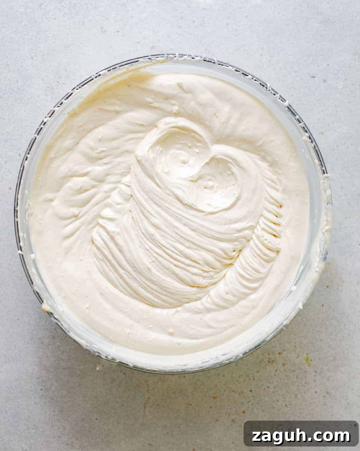 Moist Corn Pound Cake Recipe with Creamy Cornmeal Crumble 9 honey buttercream in a mixing bowl.