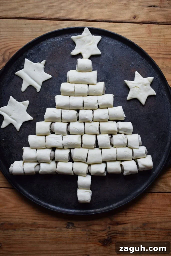 Festive Sausage Roll Christmas Tree Recipe Tutorial 9 Sausage rolls in a shape of a Christmas tree.