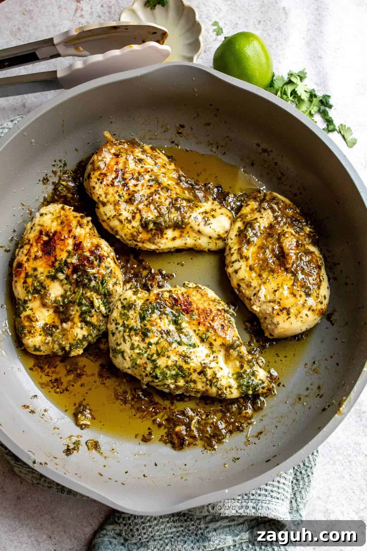 Cilantro Lime Chicken Marinade for Juicy Grilled Chicken 2 Grey skillet with Lime Chicken Marinade Cilantro in it cooked.