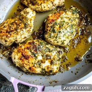 Cilantro Lime Chicken Marinade for Juicy Grilled Chicken 6 Grey skillet with Cilantro and Lime Chicken Marinade in it, Lime on the side.