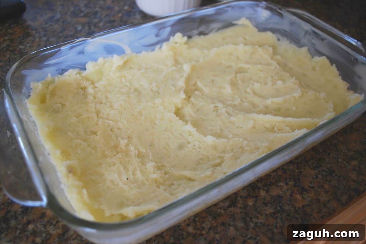 Ultimate Thanksgiving Casserole: One-Pan Holiday Dinner Recipe 5 mashed potatoes in baking dish.