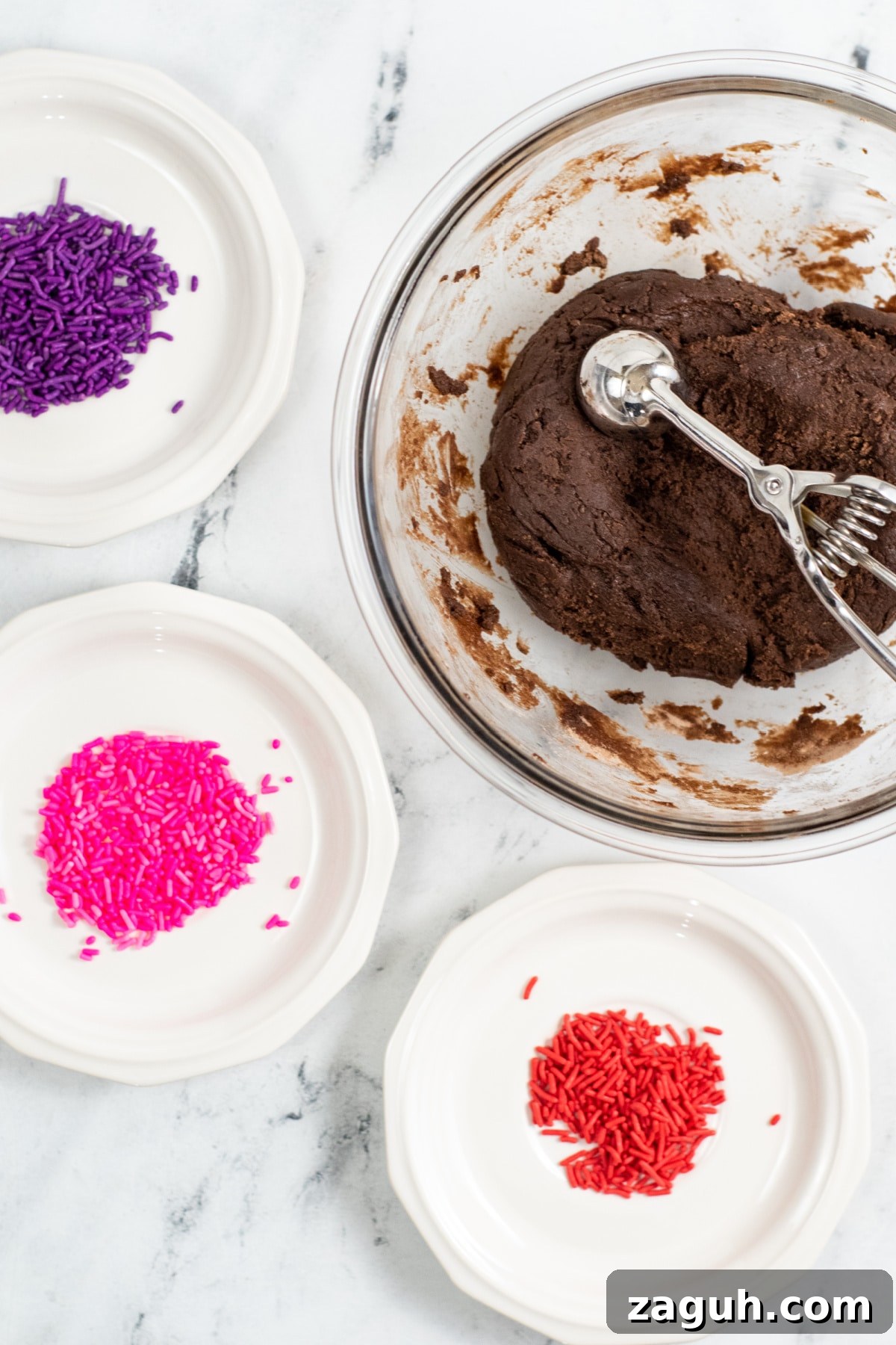 Valentine’s Day No-Bake Chocolate Brownie Bites 5 scoop brownie bites and roll in valentine sprinkles
