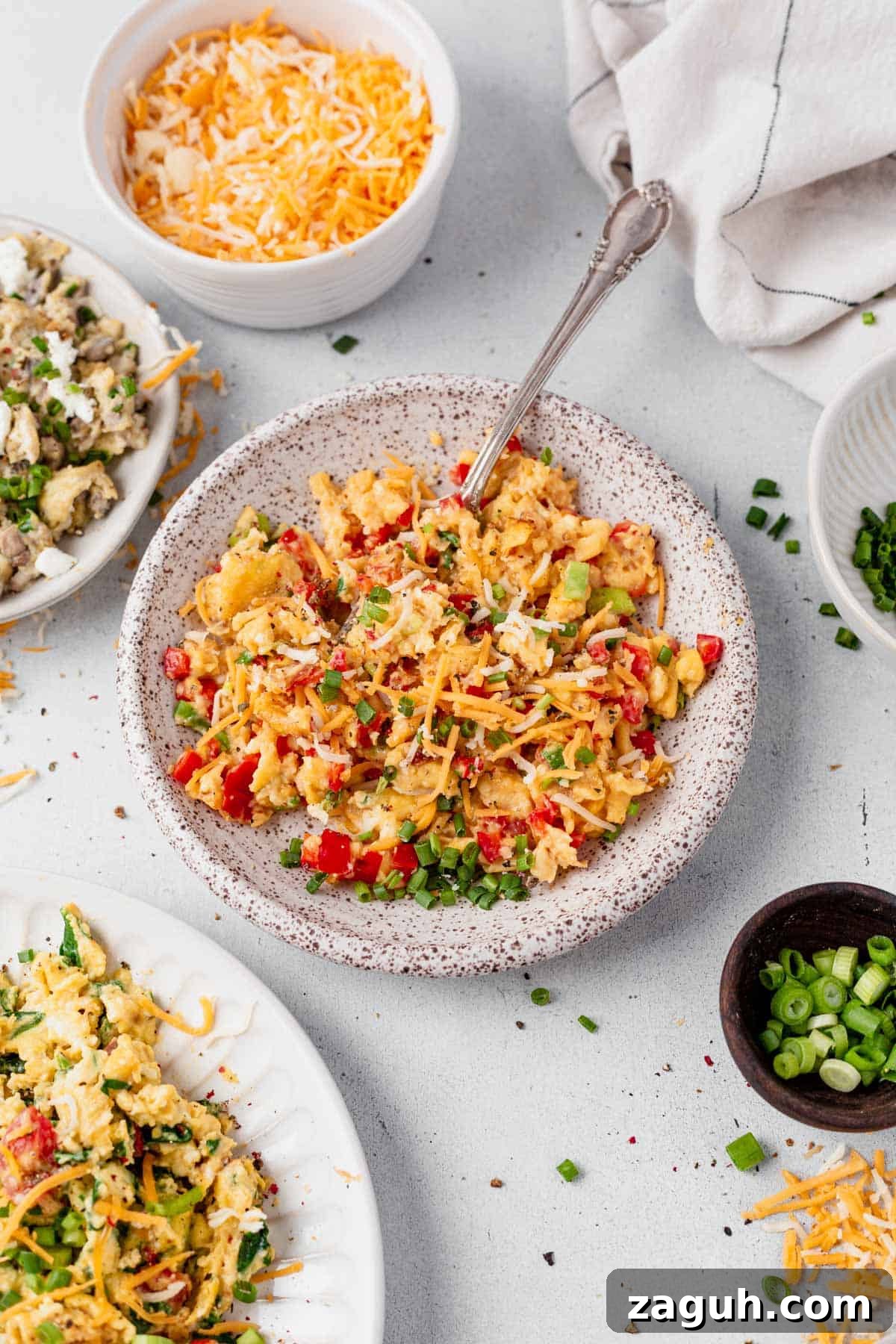 Perfectly Fluffy Scrambled Eggs in the Air Fryer 2 a bowl of air fryer scrambled eggs