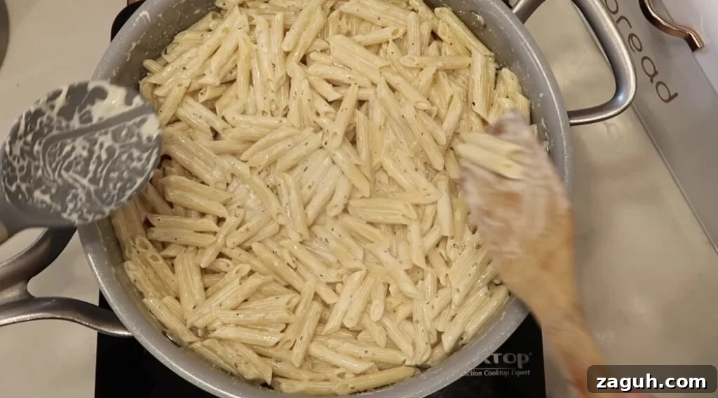 Creamy Garlic Sauce Recipe for Pasta, Chicken, and Veggies 17 Pasta fully coated in sauce