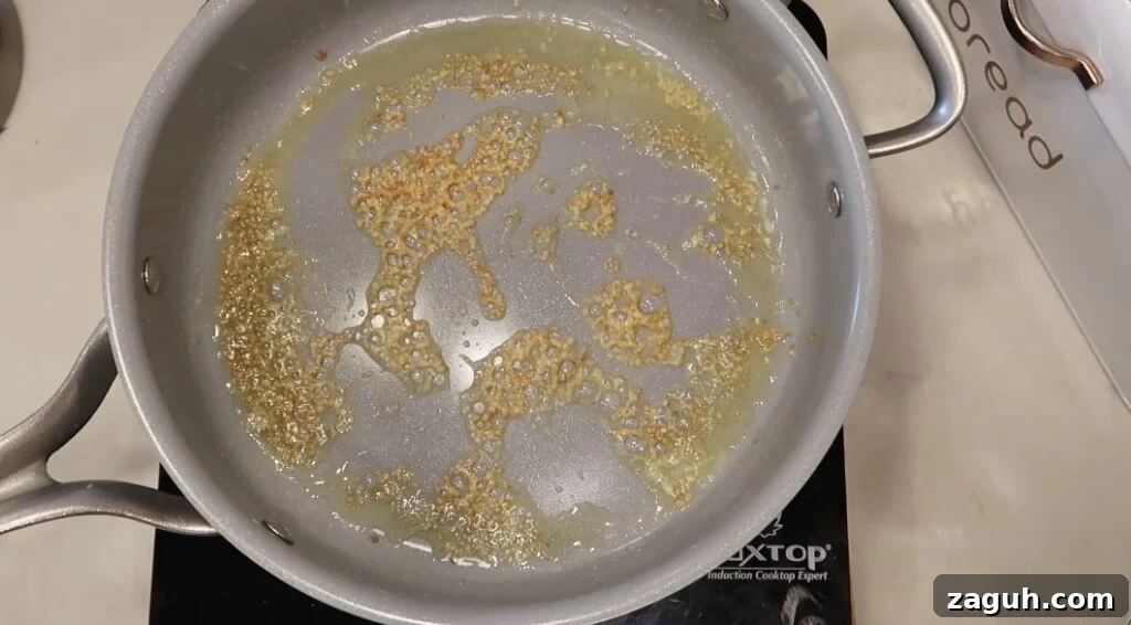 Creamy Garlic Sauce Recipe for Pasta, Chicken, and Veggies 6 Garlic sautéd to a light brown in the butter in the pan