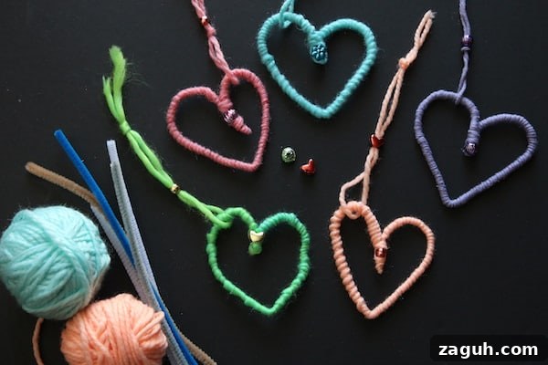 11 Valentine’s Day Crafts for Tweens and Teens to Make Together 10 horizontal yarn and pipe cleaner hearts