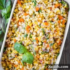 Crisp Summer Corn Salad with Cherry Tomatoes and Herbs 6 rectangle dish of vegetable salad with corn