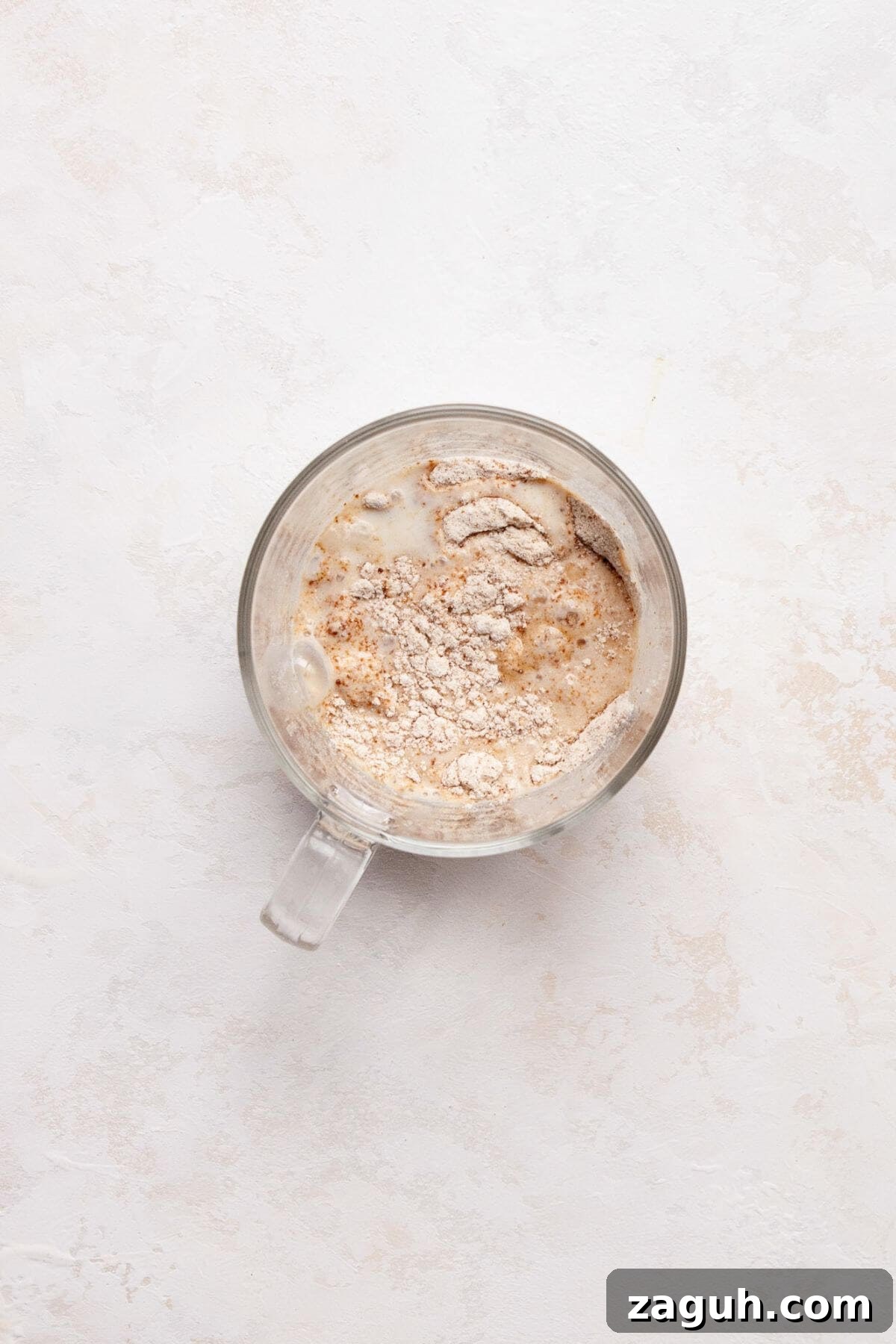 Protein Powder Mug Cake Recipe: Quick Single-Serve Treat 4 Mixing the dry ingredients with the wet ingredients in a mug.
