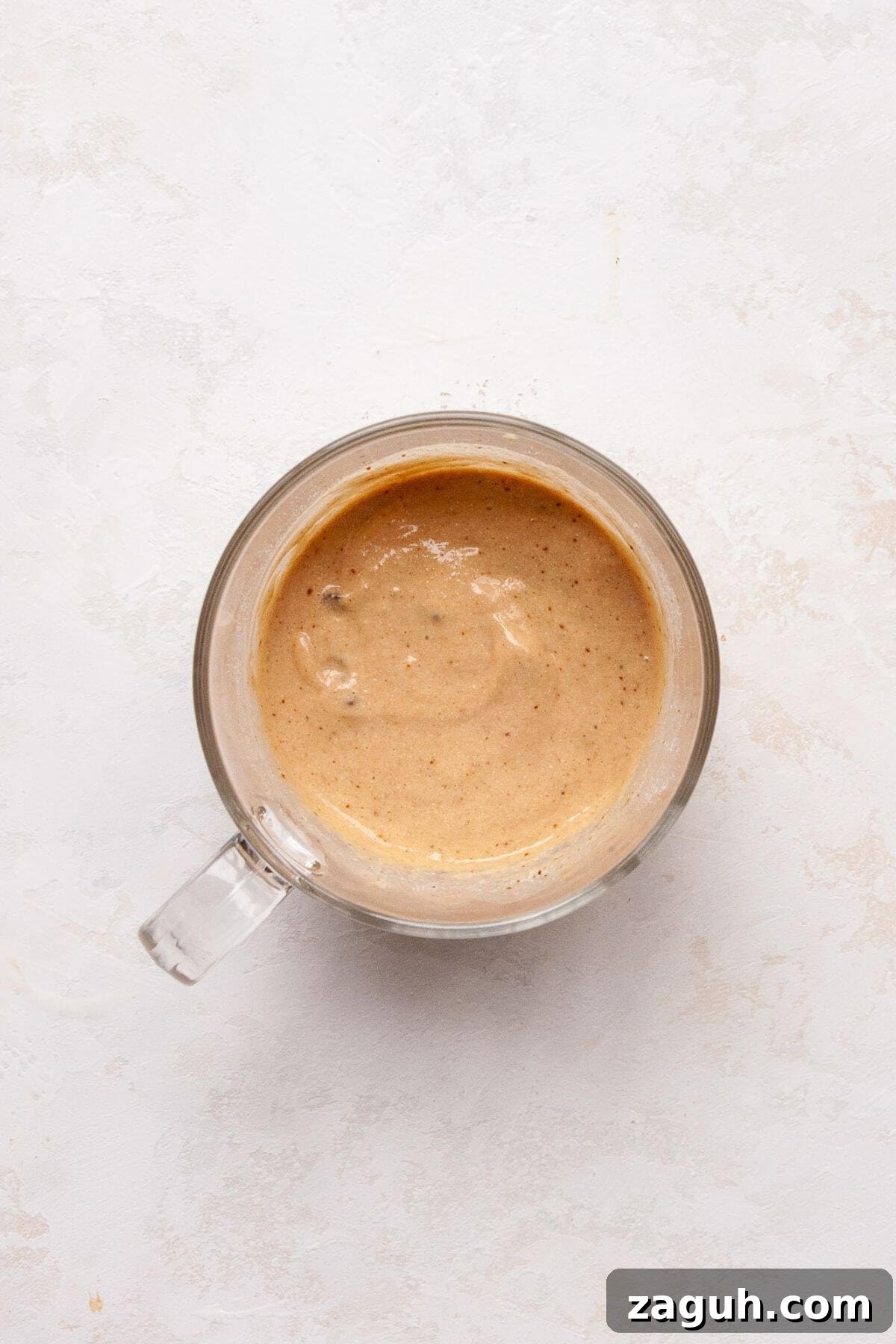 Protein Powder Mug Cake Recipe: Quick Single-Serve Treat 5 Protein mug cake batter in a glass mug before microwaving.
