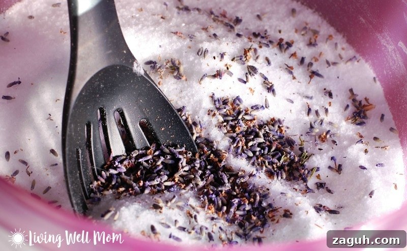 Lavender Epsom Salt Foot Soak Recipe for Relaxation 4 homemade Epsom salt foot scrub mixture with dried lavender and black spoon