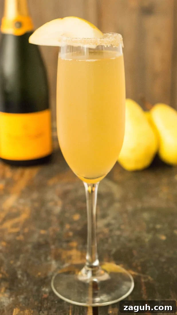 4 Fall Mimosa Recipes to Celebrate the Season 4 A champagne flute filled with a vanilla bean pear mimosa.