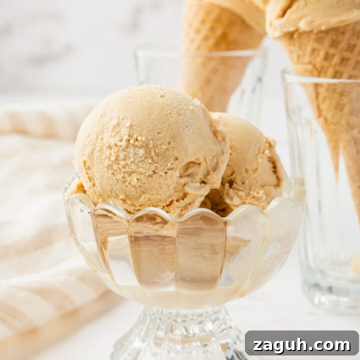 a footed glass bowl of homemade caramel ice cream
