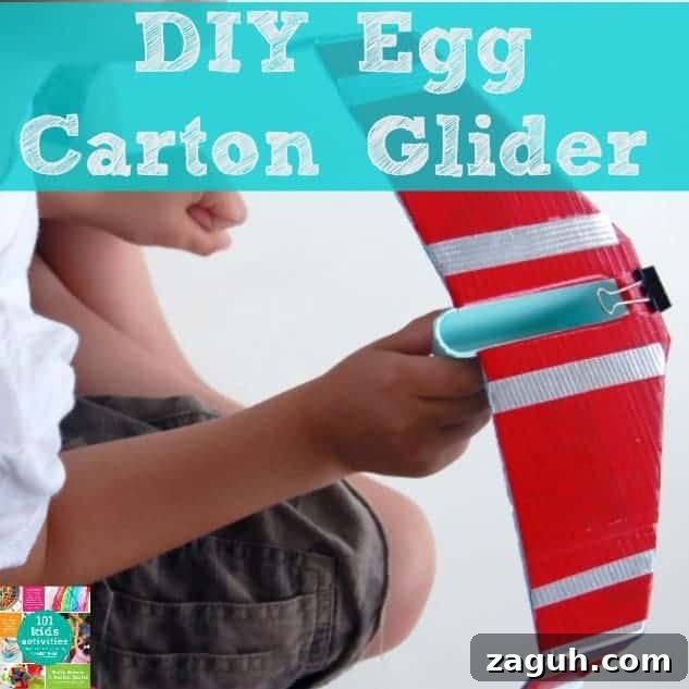 A boy holding a Glider made from an egg carton with text above him.