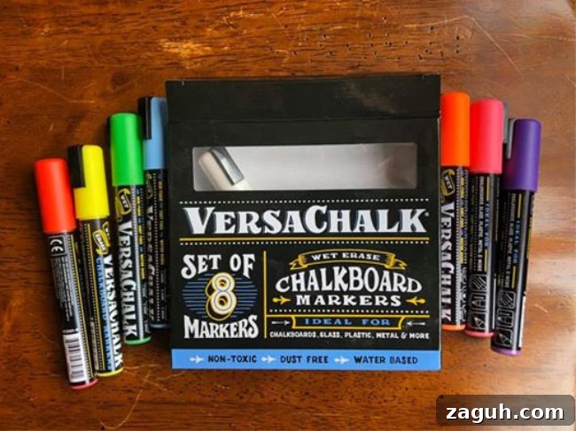 Chalkboard markers on a wooden table.