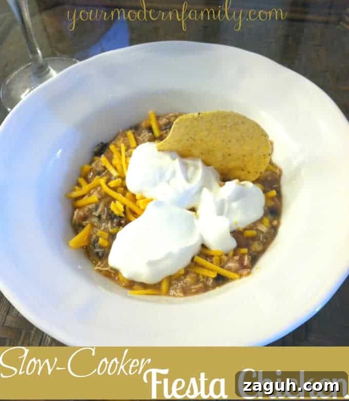 A bowl of food with cream cheese on the top.
