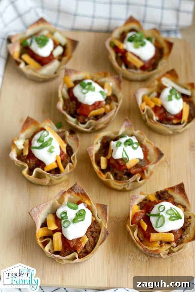 A plate filled with Taco and Cheese cups for a football party.