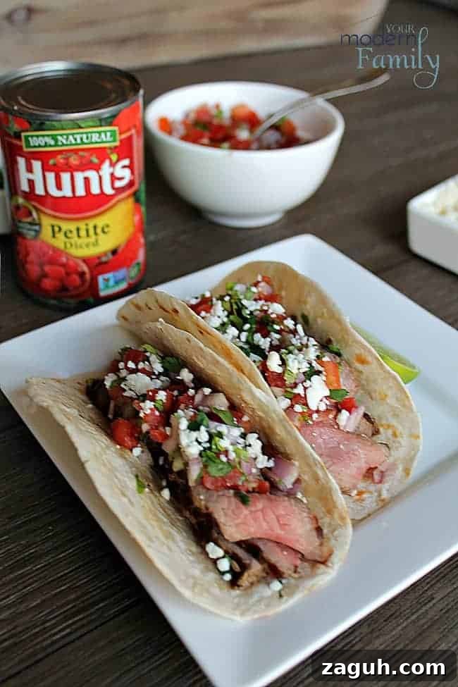 A plate of Tacos with a can of diced tomatoes beside it.