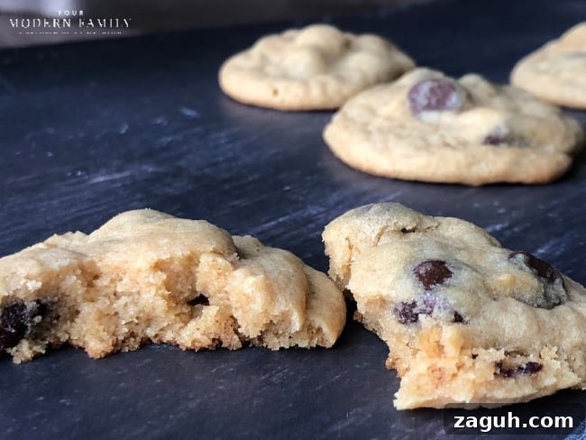Homemade chocolate chip cookies on a wooden table.