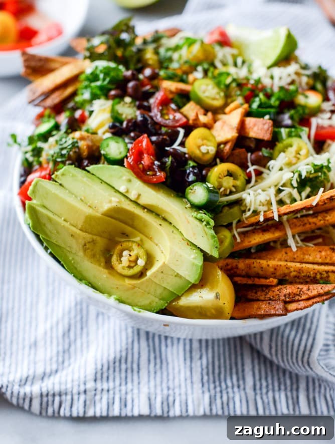 Crunchy Taco Kale Salad Recipe with Avocado & Lime Dressing 7 crunchy taco kale salad I howsweeteats.com