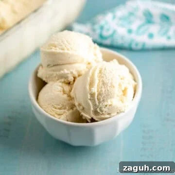A bowl filled with scoops of homemade vanilla ice cream.